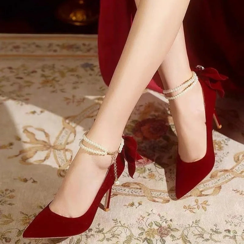 Red Xiuhe wedding shoes new pointy stiletto high heels female shallow mouth bow pearl one word buckle strap two wear bride shoes
