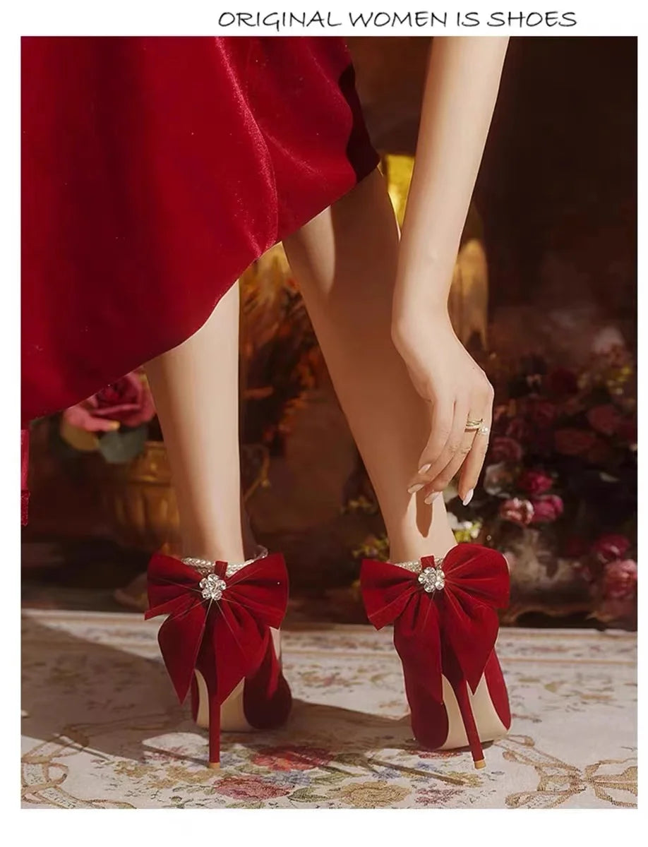 Red Xiuhe wedding shoes new pointy stiletto high heels female shallow mouth bow pearl one word buckle strap two wear bride shoes